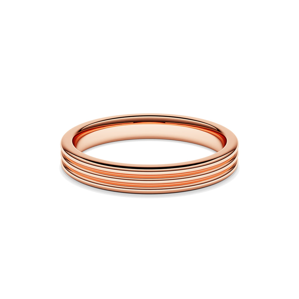 A ring with a minimalist design with repeating shapes in rose gold band