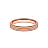 A ring with a minimalist design with repeating shapes in rose gold band