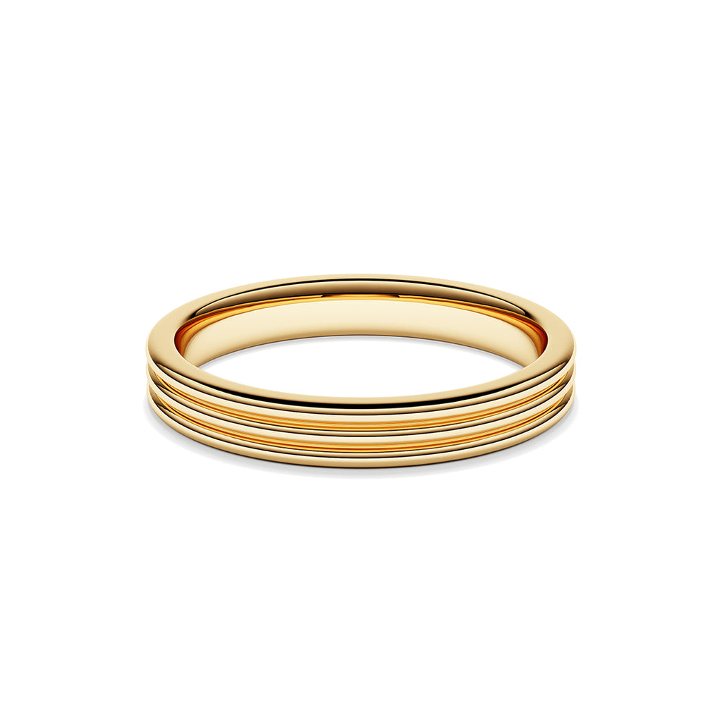 A ring with a minimalist design with repeating shapes in yellow gold band