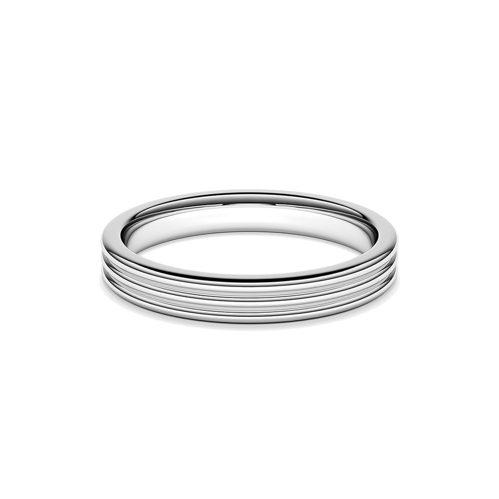 A ring with a minimalist design with repeating shapes in platinum band