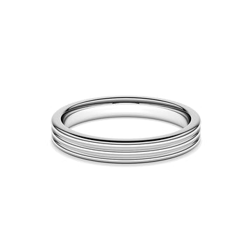 A ring with a minimalist design with repeating shapes in platinum band